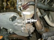  Top tensioner bolt removal