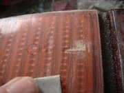 Take the most wet & dry coarse paper you have and sand off